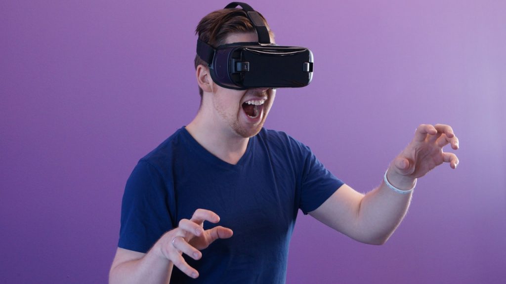 Man playing a game with VR set