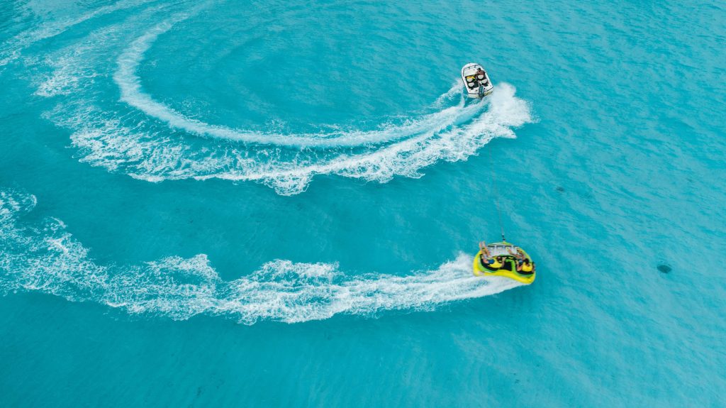 Tubing behind a boat in the sea