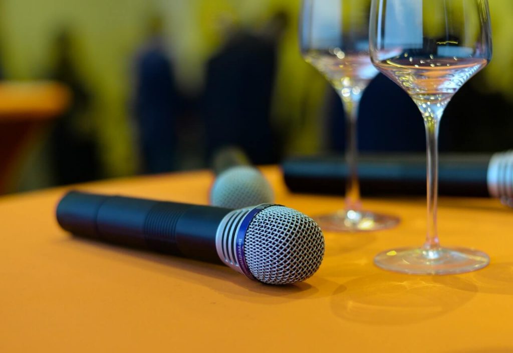 Microphone on top of the table near glass